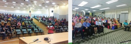 Full lecture theatre with the speaker at the front, and a seated seminar audience in a training room