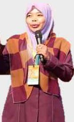Norwani binti Ahmat speaking with a microphone
